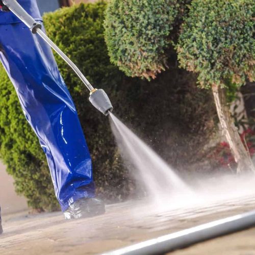 Men Washing Garden Residential Brick Paths with Professional Pressure Washer